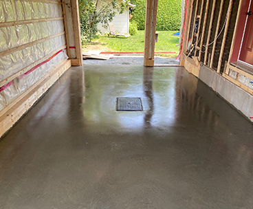 Mise en place et finition de beton pour dalle de garage Longueuil - Finition de plancher de garage en béton à la truelle mécanique avec scellant